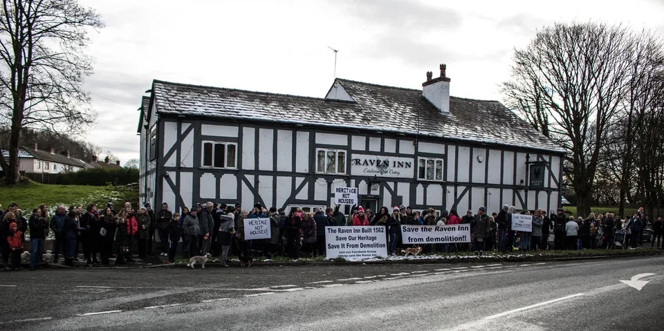 In 2019, plans were discovered by the local community that the owners wanted the Raven Inn demolished for redevelopment. The ‘Save the Raven’ action group was founded by Maureen (Moe) Parkinson and Carole (Tufty) Watson. The team grew and was shortly joined by Peter Sturman as Chair of the group; a peaceful protest was organised.